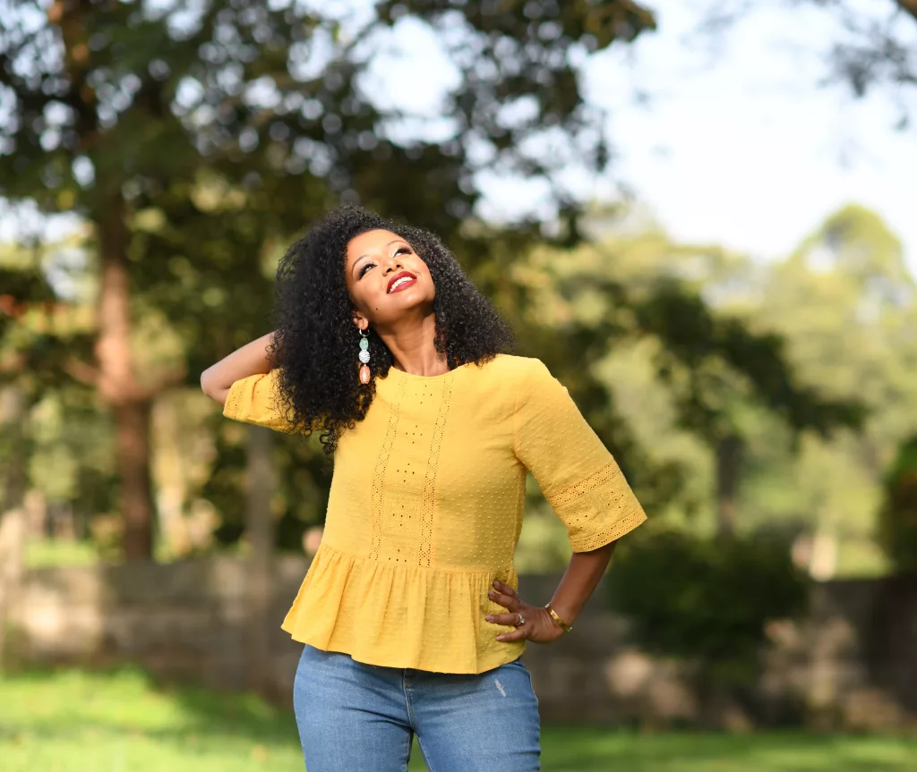 Glisen founder Selam Emiru posing outside.