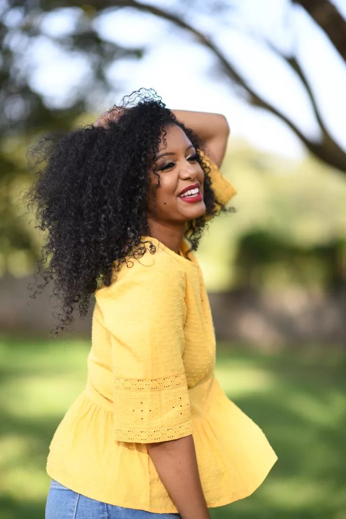 Glisen founder Selam Emiru posing outside.