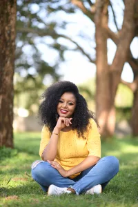 Glisen founder Selam Emiru posing outside.